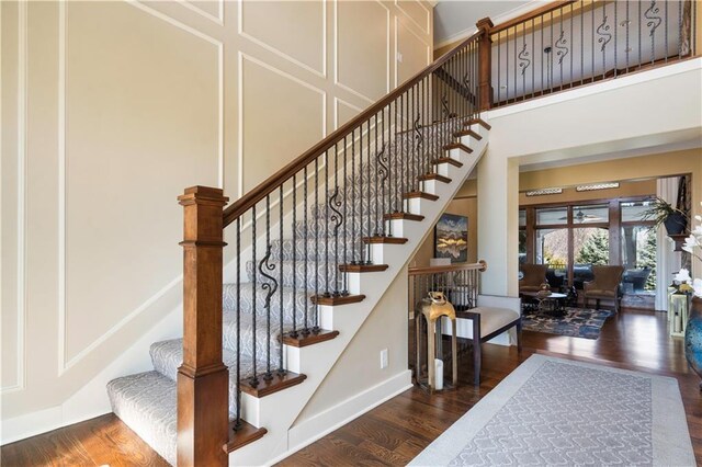 20711 Benson St, Bucyrus, KS 66013 - stairs with wood finished floors and a high ceiling