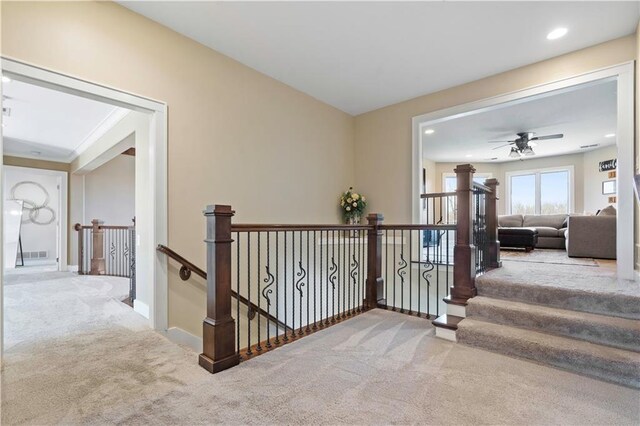 20711 Benson St, Bucyrus, KS 66013 - hallway featuring carpet floors, an upstairs landing, and recessed lighting