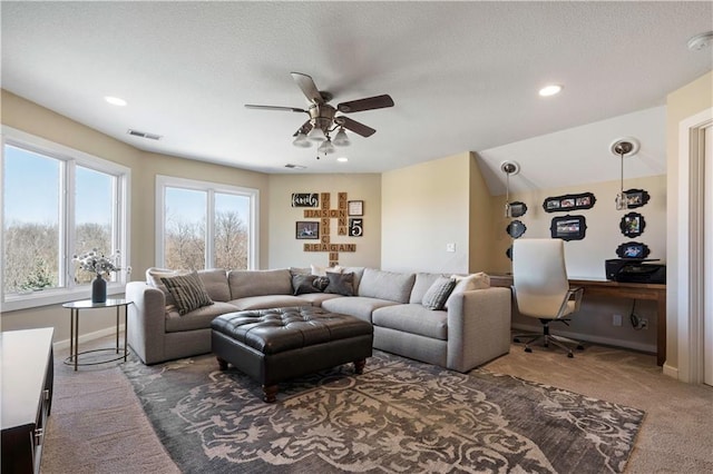 20711 Benson St, Bucyrus, KS 66013 - carpeted living room featuring ceiling fan, an office area, and recessed lighting