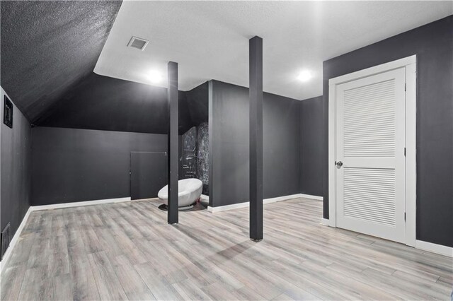 20711 Benson St, Bucyrus, KS 66013 - additional living space featuring wood finished floors and lofted ceiling