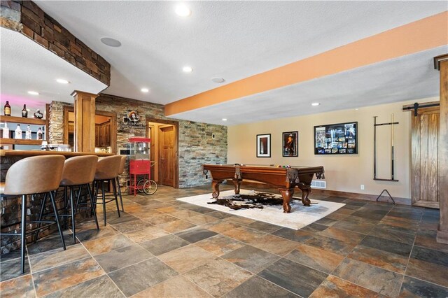 20711 Benson St, Bucyrus, KS 66013 - game room with stone tile flooring, billiards table, a barn door, recessed lighting, and a dry bar