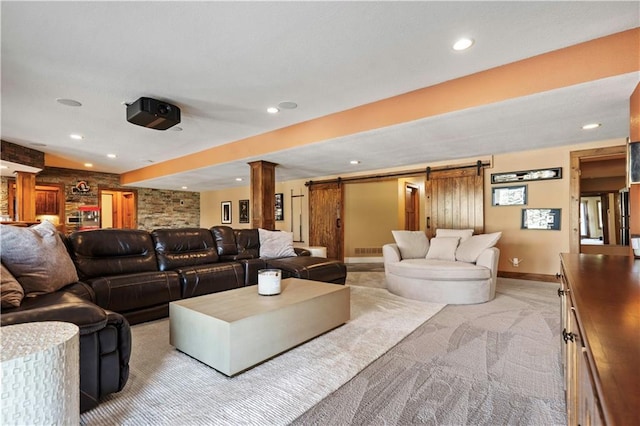 20711 Benson St, Bucyrus, KS 66013 - living area featuring a barn door, light carpet, decorative columns, and recessed lighting