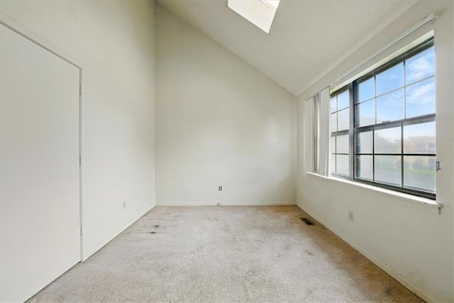 11431 Reeder St, Overland Park, KS 66210 - carpeted spare room with lofted ceiling and a skylight