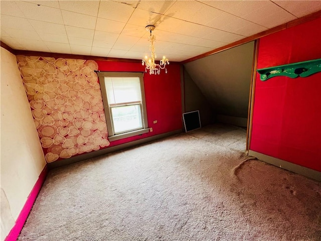 107 W 23rd St, Higginsville, MO 64037 - bonus room featuring carpet, a chandelier, and vaulted ceiling