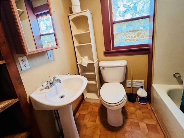 107 W 23rd St, Higginsville, MO 64037 - full bath with a tub to relax in and a shower