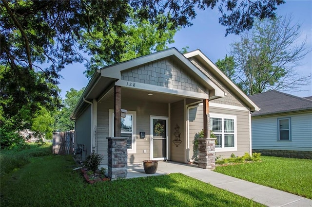 128 S Poplar St, Ottawa, KS 66067 - view of front of home featuring a front lawn
