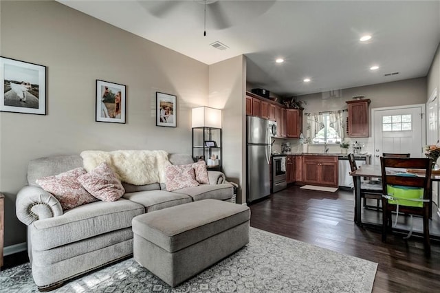 128 S Poplar St, Ottawa, KS 66067 - living area featuring a ceiling fan, dark wood-style flooring, and recessed lighting