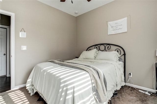 128 S Poplar St, Ottawa, KS 66067 - bedroom with baseboards, carpet floors, and a ceiling fan