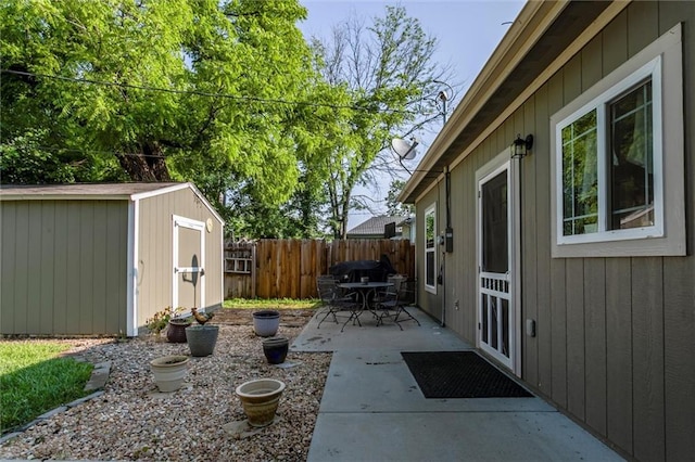 128 S Poplar St, Ottawa, KS 66067 - fenced backyard featuring a patio and outdoor dining area