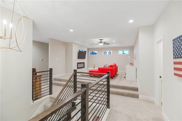 12507 W 183rd Ter, Overland Park, KS 66013 - hallway featuring carpet floors, recessed lighting, baseboards, a tray ceiling, and an upstairs landing