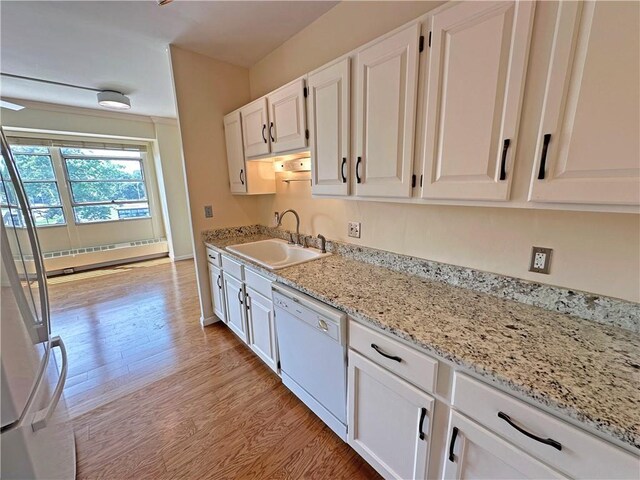 333 W Meyer Blvd Unit 414, Kansas City, MO 64113 - kitchen with a sink, dishwasher, light wood-style floors, white cabinets, and light stone counters