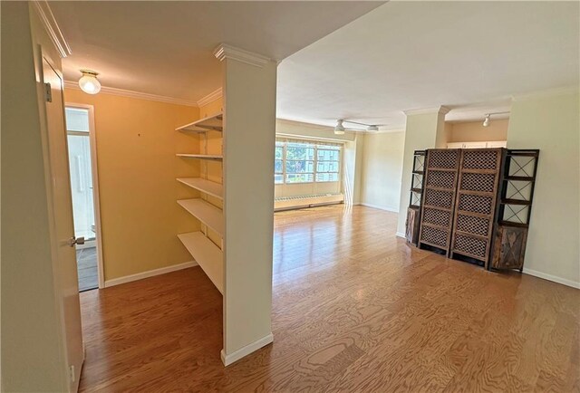 333 W Meyer Blvd Unit 414, Kansas City, MO 64113 - hallway with wood finished floors, crown molding, and baseboards