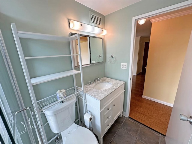 333 W Meyer Blvd Unit 414, Kansas City, MO 64113 - bathroom with vanity, toilet, and tile patterned flooring