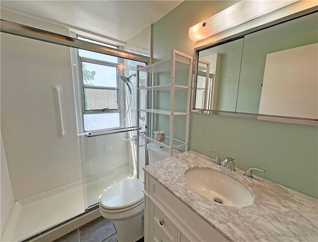 333 W Meyer Blvd Unit 414, Kansas City, MO 64113 - full bath featuring toilet, a stall shower, and vanity