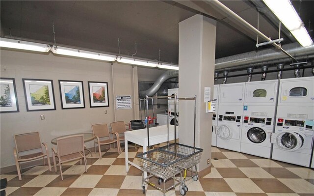 333 W Meyer Blvd Unit 414, Kansas City, MO 64113 - community laundry with stacked washing machine and dryer and tile patterned floors