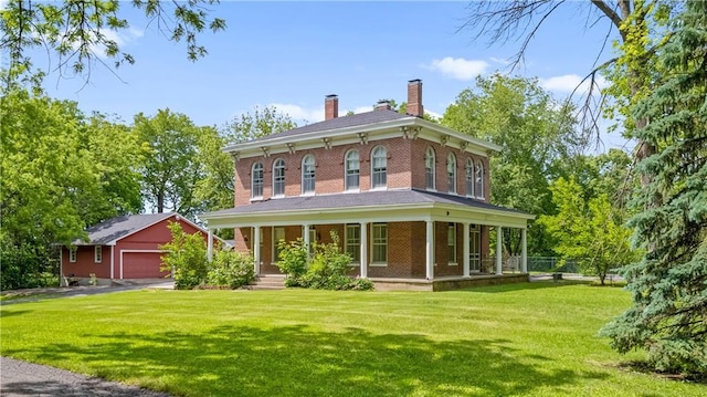 5322 SE Riverside Ter, Saint Joseph, MO 64507 - italianate house featuring a porch, an outdoor structure, a detached garage, a chimney, and brick siding