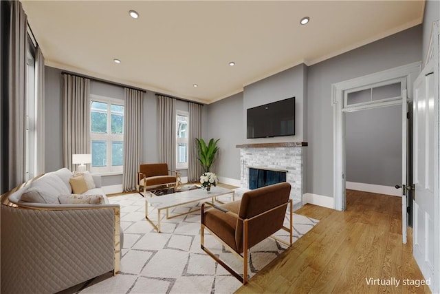 5322 SE Riverside Ter, Saint Joseph, MO 64507 - living area with ornamental molding, a brick fireplace, light wood-style flooring, baseboards, and recessed lighting