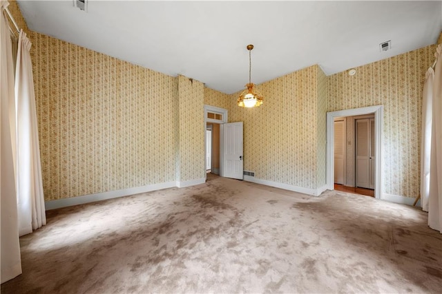 5322 SE Riverside Ter, Saint Joseph, MO 64507 - unfurnished dining area with carpet and wallpapered walls