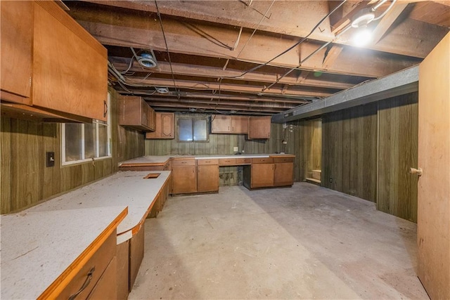 5322 SE Riverside Ter, Saint Joseph, MO 64507 - unfinished basement with wooden walls and a workshop area