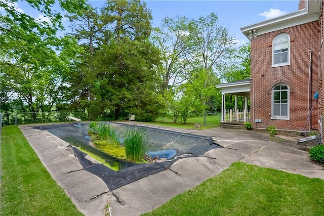 5322 SE Riverside Ter, Saint Joseph, MO 64507 - view of swimming pool with a lawn, a covered pool, and a patio