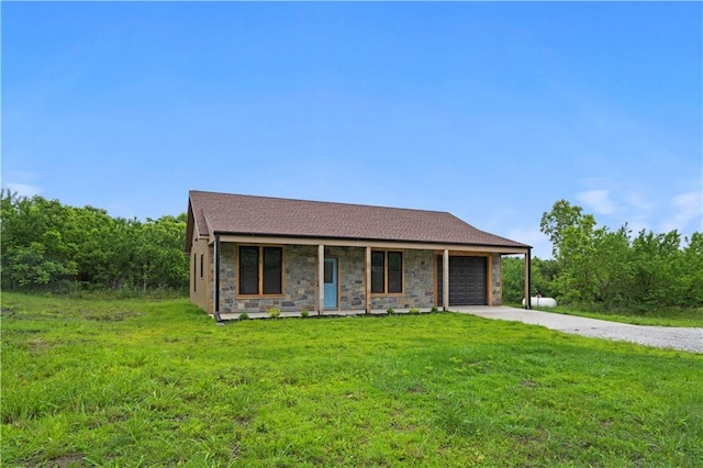 26696 235th St, Mclouth, KS 66054 - view of front facade with concrete driveway, an attached garage, a front lawn, and stone siding