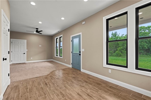 26696 235th St, Mclouth, KS 66054 - empty room with healthy amount of natural light, baseboards, recessed lighting, ceiling fan, and light wood-style floors