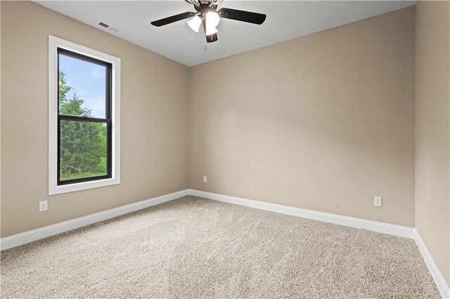 26696 235th St, Mclouth, KS 66054 - empty room with baseboards, carpet flooring, and ceiling fan