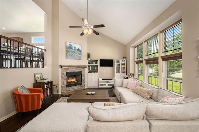 13511 W 56th Ter, Shawnee, KS 66216 - living room with high vaulted ceiling, plenty of natural light, dark wood-style flooring, ceiling fan, and a fireplace