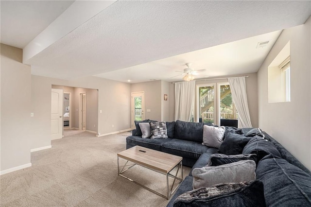 13511 W 56th Ter, Shawnee, KS 66216 - living area with light colored carpet, a ceiling fan, and a textured ceiling
