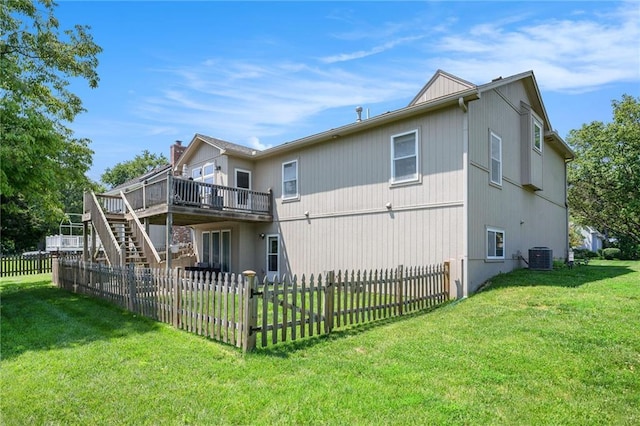 13511 W 56th Ter, Shawnee, KS 66216 - back of house with a wooden deck, a fenced backyard, and stairs