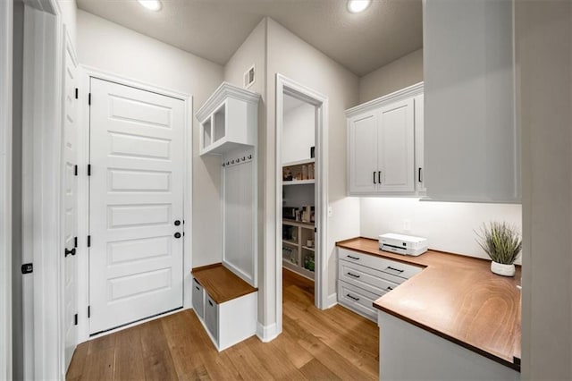 3053 NW Thoreau Ln, Lees Summit, MO 64081 - mudroom featuring light wood-style flooring and recessed lighting