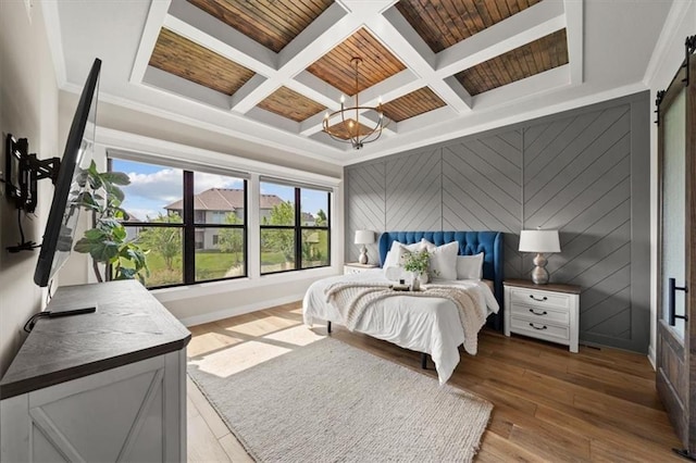 3053 NW Thoreau Ln, Lees Summit, MO 64081 - bedroom featuring coffered ceiling, hardwood / wood-style floors, a barn door, beamed ceiling, and ornamental molding
