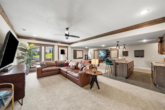 3053 NW Thoreau Ln, Lees Summit, MO 64081 - living area featuring dark colored carpet, ornamental molding, a textured ceiling, a ceiling fan, and recessed lighting