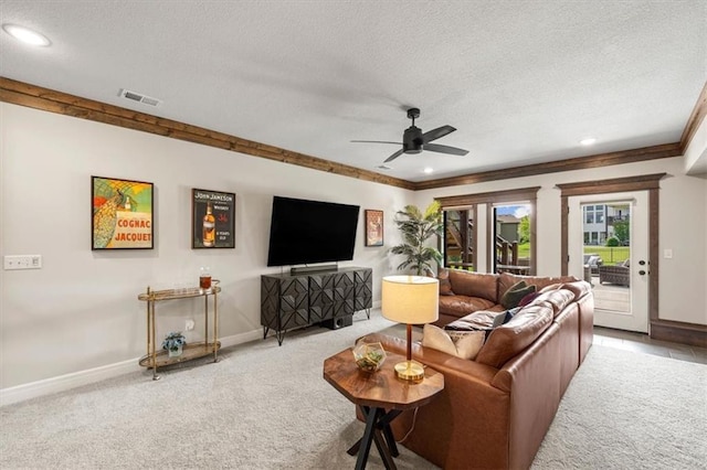 3053 NW Thoreau Ln, Lees Summit, MO 64081 - carpeted living room featuring a textured ceiling, ceiling fan, ornamental molding, and recessed lighting