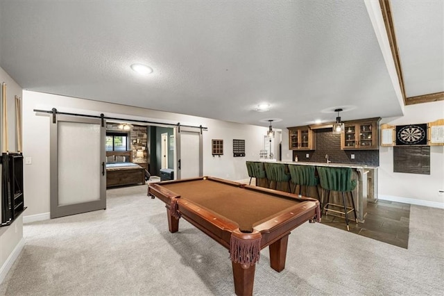3053 NW Thoreau Ln, Lees Summit, MO 64081 - playroom with a barn door, wet bar, light carpet, a textured ceiling, and pool table