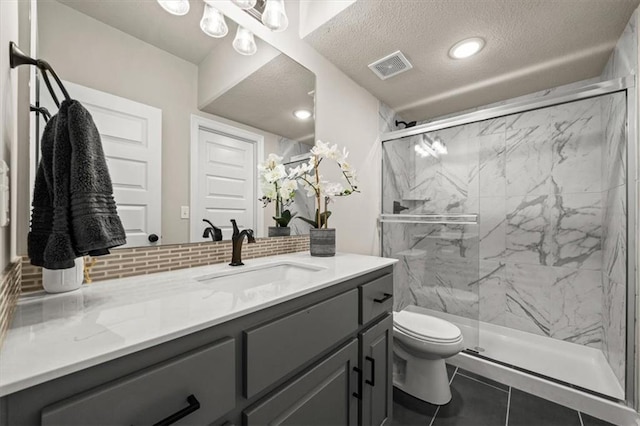 3053 NW Thoreau Ln, Lees Summit, MO 64081 - bathroom with vanity, a marble finish shower, tasteful backsplash, and a textured ceiling