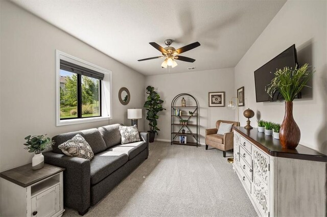 3053 NW Thoreau Ln, Lees Summit, MO 64081 - living room with light carpet and a ceiling fan