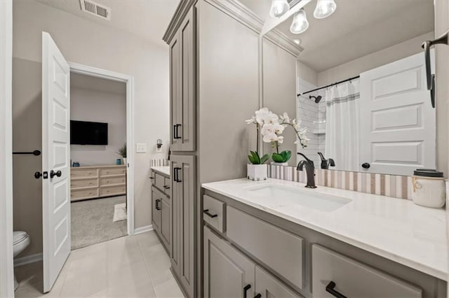 3053 NW Thoreau Ln, Lees Summit, MO 64081 - ensuite bathroom with vanity, a shower with curtain, and tile patterned floors