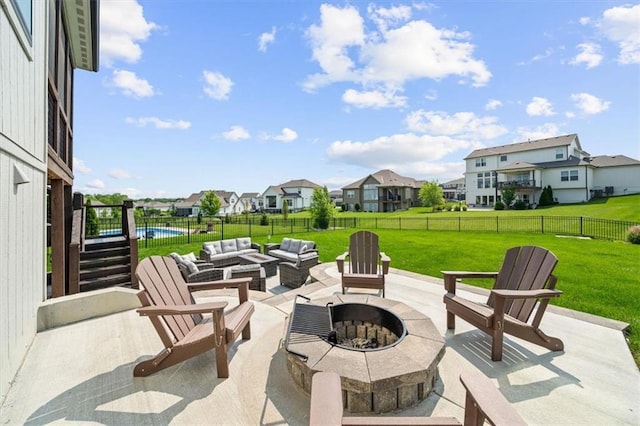 3053 NW Thoreau Ln, Lees Summit, MO 64081 - fenced backyard featuring a patio, a residential view, and an outdoor living space with a fire pit