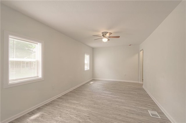 3874 E 63rd St, Kansas City, MO 64130 - spare room featuring ceiling fan and light wood finished floors