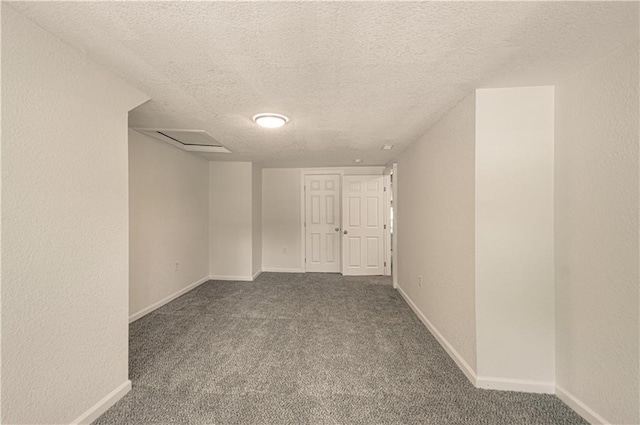 3874 E 63rd St, Kansas City, MO 64130 - carpeted spare room featuring a textured ceiling and baseboards