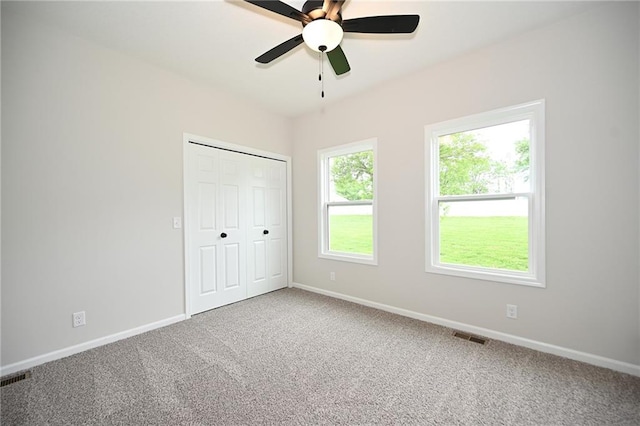 18 Timber Creek Cir, Platte City, MO 64079 - unfurnished bedroom featuring baseboards, carpet flooring, a closet, and ceiling fan