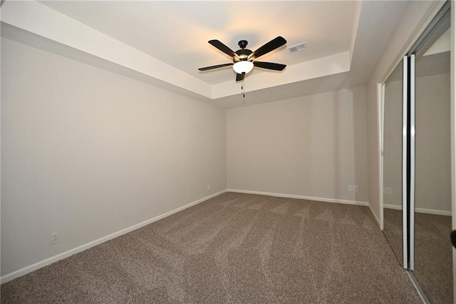 18 Timber Creek Cir, Platte City, MO 64079 - unfurnished bedroom with a raised ceiling, carpet flooring, baseboards, and a ceiling fan
