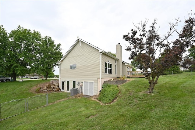 18 Timber Creek Cir, Platte City, MO 64079 - view of property exterior featuring a chimney and central AC unit