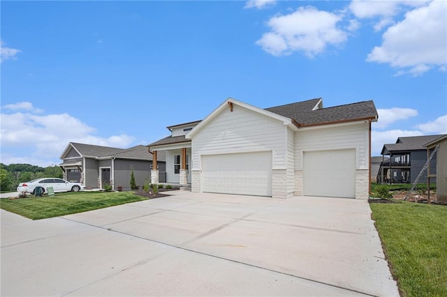 12445 Empress St, Platte City, MO 64079 - view of front of home featuring an attached garage, concrete driveway, a front yard, and a shingled roof