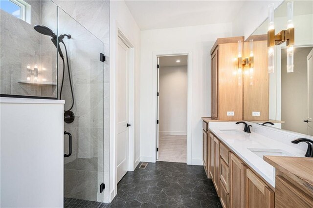 12445 Empress St, Platte City, MO 64079 - full bathroom featuring a stall shower, double vanity, and baseboards