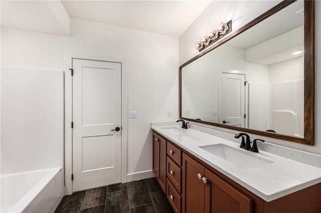 12445 Empress St, Platte City, MO 64079 - full bathroom featuring double vanity, a bathtub, and baseboards