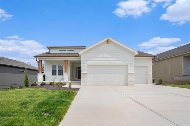 12445 Empress St, Platte City, MO 64079 - prairie-style home with a garage, driveway, a front lawn, covered porch, and stone siding