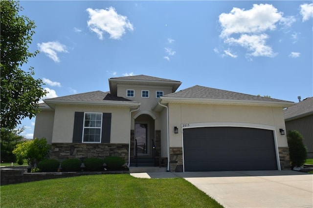 2015 Creek View Ln, Raymore, MO 64083 - prairie-style house featuring stone siding, stucco siding, driveway, a garage, and a front lawn