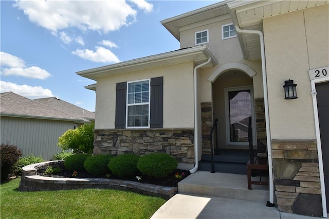 2015 Creek View Ln, Raymore, MO 64083 - view of exterior entry with stone siding and stucco siding